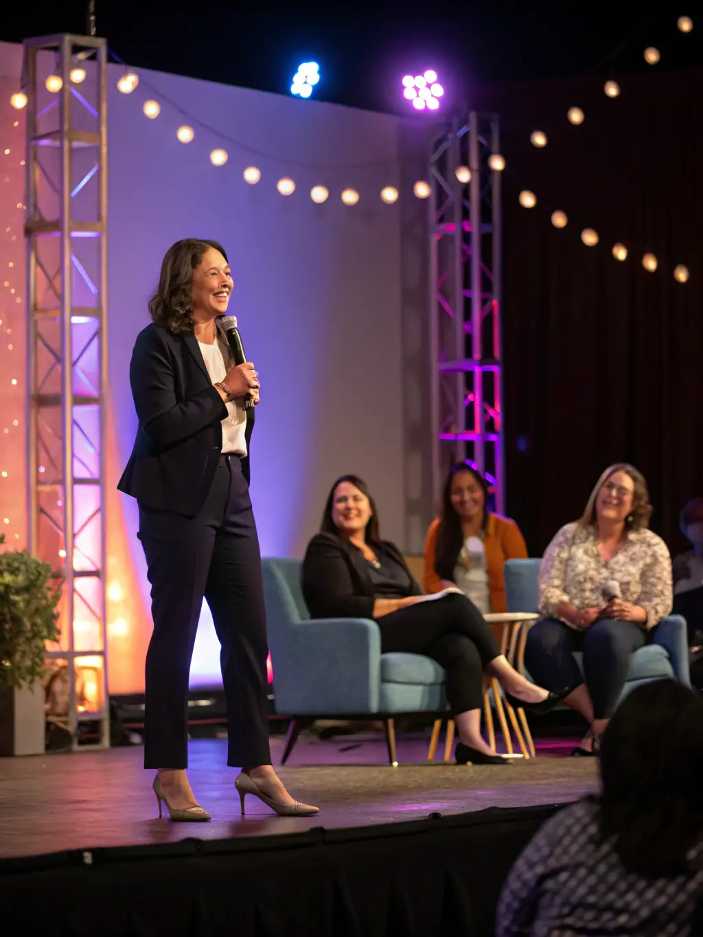An engaging photo of a keynote speaker addressing a large audience at the Edinburgh International Conference Centre during the Scottish Enterprise Conference on December 7, 2024.